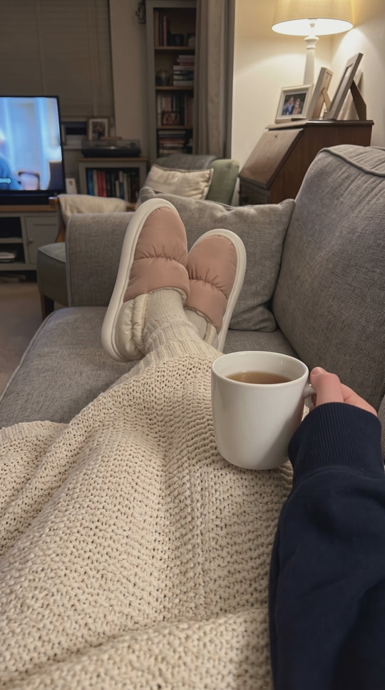 Evening on the sofa in pink Cloowdy slippers with a cup of tea